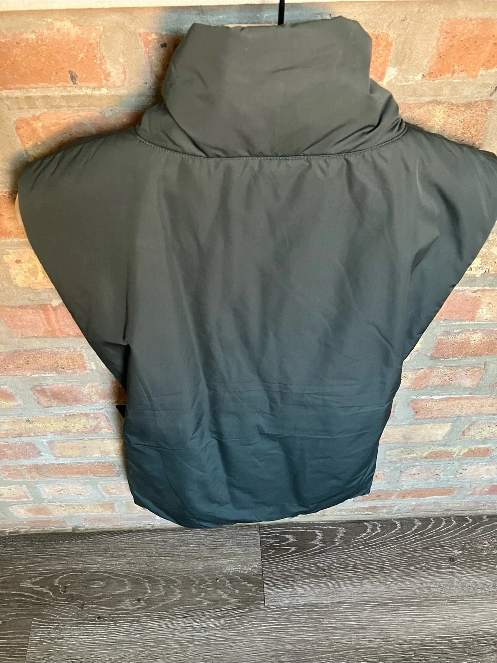 dark green COS high-neck padded vest